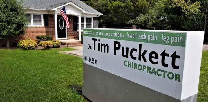 York Chiropractic Center | green and white sign outside of York Chiropractic Center building with Dr. Tim Puckett's name on it